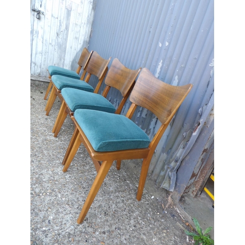 131 - A set of four retro butterfly back dining chairs