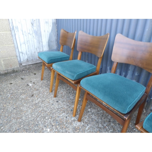 131 - A set of four retro butterfly back dining chairs