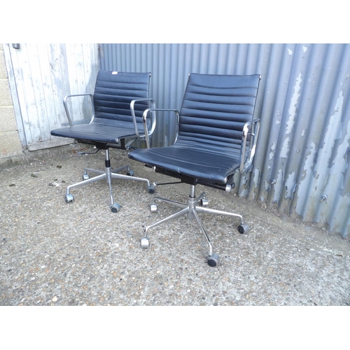 133 - A pair of chrome and black leather swivel office chairs