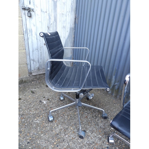 133 - A pair of chrome and black leather swivel office chairs