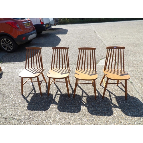 135 - A set of four mid century stick back kitchen chairs