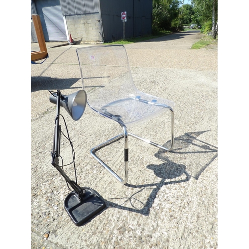 139 - Modern chrome and perspex chair together with a work lamp