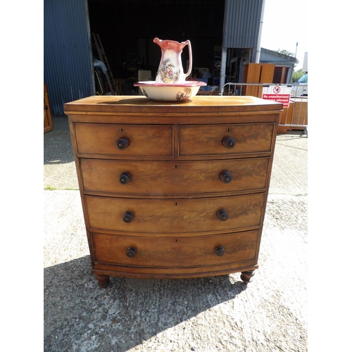 140 - A victorian mahogany bow font chest of drawers together with ceramic jug and bowl102x40x112