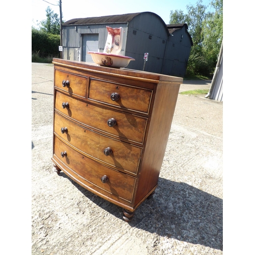 140 - A victorian mahogany bow font chest of drawers together with ceramic jug and bowl102x40x112