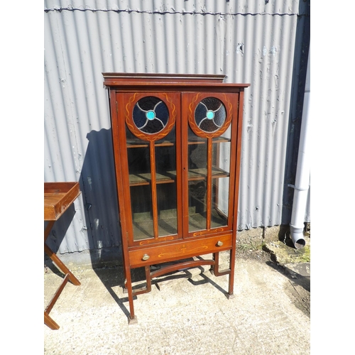 148 - A mahogany arts and crafts display cabinet with stained glass panels