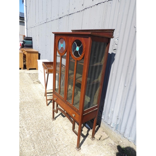 148 - A mahogany arts and crafts display cabinet with stained glass panels