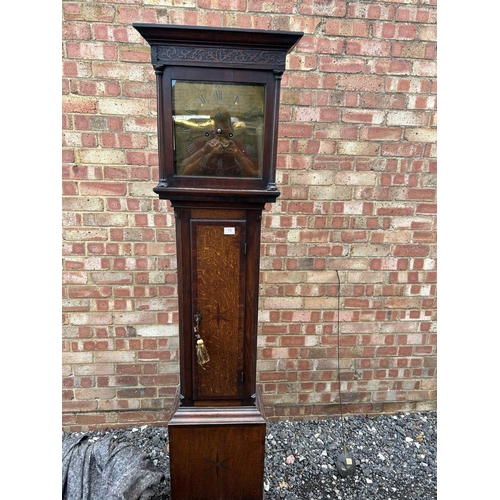 15 - An oak cased longcase clock with brass dial by JOHN MURCH of Honiton