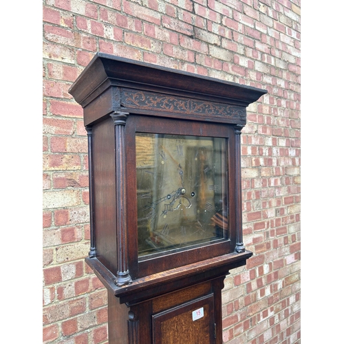 15 - An oak cased longcase clock with brass dial by JOHN MURCH of Honiton