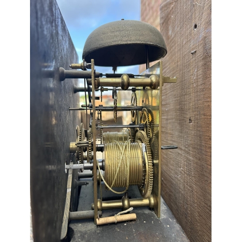 15 - An oak cased longcase clock with brass dial by JOHN MURCH of Honiton