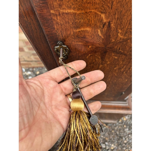 15 - An oak cased longcase clock with brass dial by JOHN MURCH of Honiton