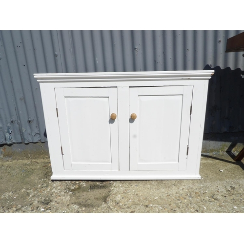 150 - A white painted pine two door cupboard