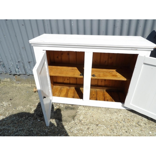 150 - A white painted pine two door cupboard