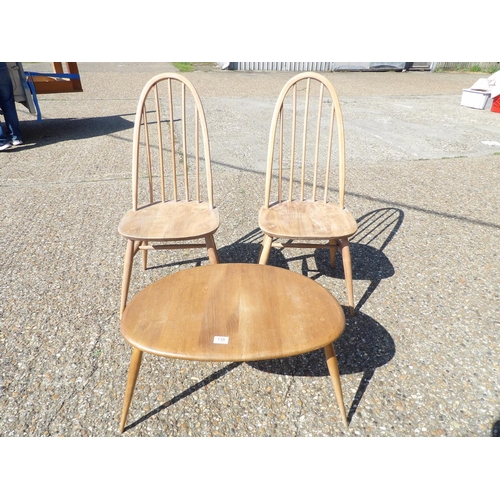 156 - A pair of ercol chairs together with large pebble occasional table