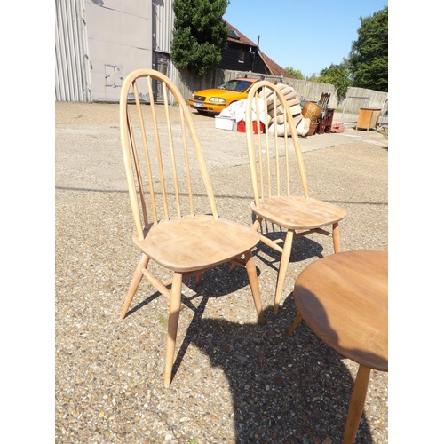 156 - A pair of ercol chairs together with large pebble occasional table