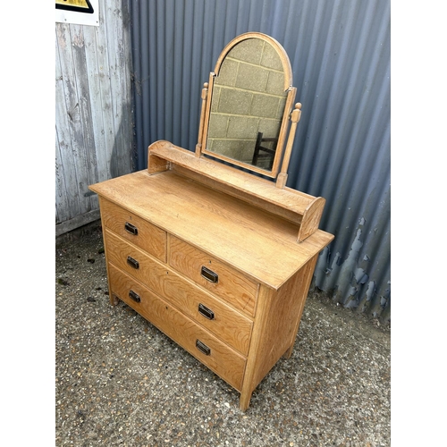 160 - An original light oak dressing chest of four drawers by HEALS 107x48x77