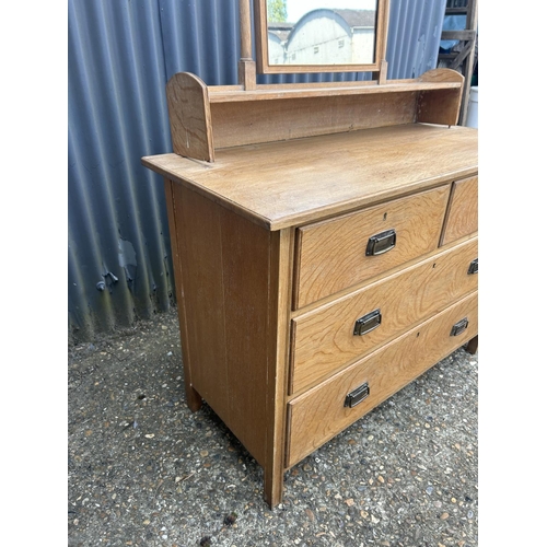 160 - An original light oak dressing chest of four drawers by HEALS 107x48x77