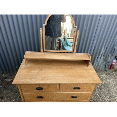 160 - An original light oak dressing chest of four drawers by HEALS 107x48x77