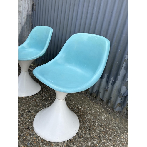 162 - A set of three blue and white plastic tub chairs