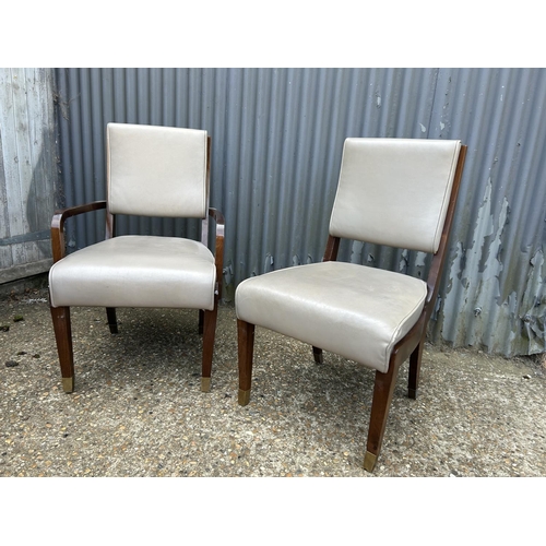 163 - A ladies and gents pair of mid century leather chairs