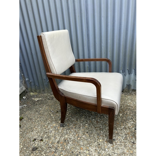 163 - A ladies and gents pair of mid century leather chairs