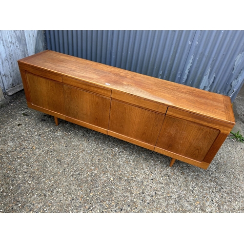 164 - A mid century teak sideboard with four drawers over four cupboard doors  200x45 x78