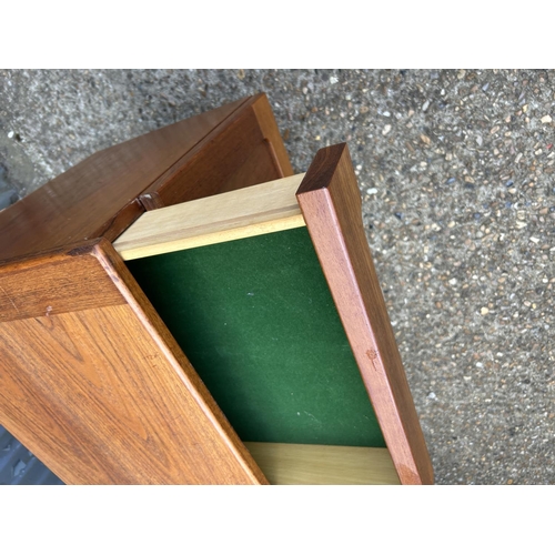 164 - A mid century teak sideboard with four drawers over four cupboard doors  200x45 x78