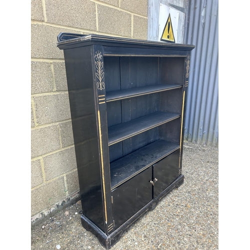 168 - An Edwardian ebonised open fronted bookcase 108x38x130