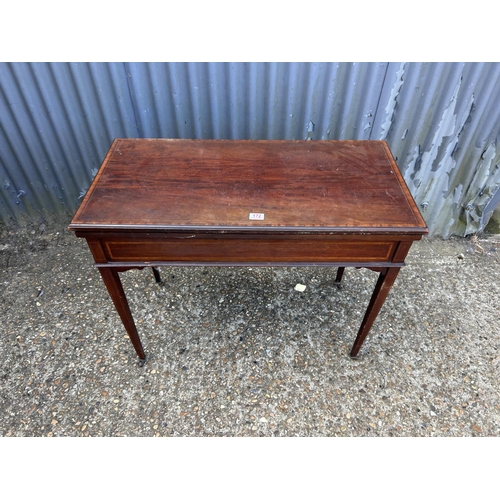 172 - An Edwardian mahogany fold over card table