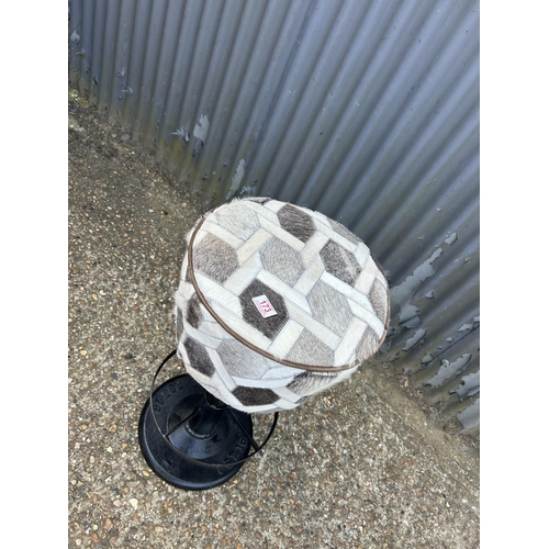 173 - An iron based bar stool with grey fur upholstered seat