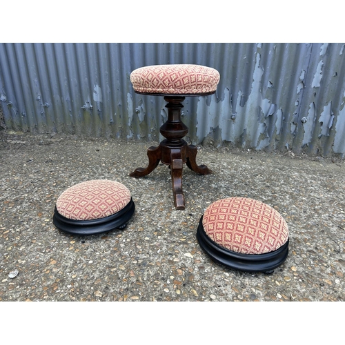 175 - A Victorian swivel piano stool together with two small footstools