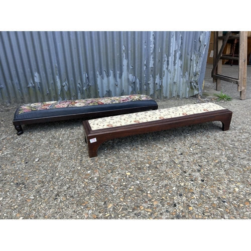 176 - Two long mahogany frame footstools with upholstered tops