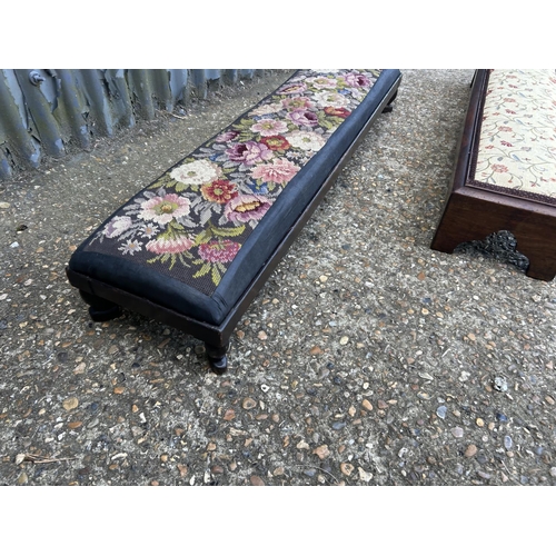 176 - Two long mahogany frame footstools with upholstered tops