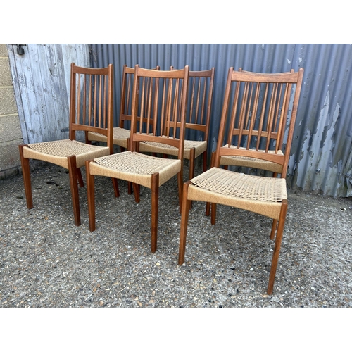 185 - A set of six danish teak dining chairs with rush seats by MOGENS KOLD