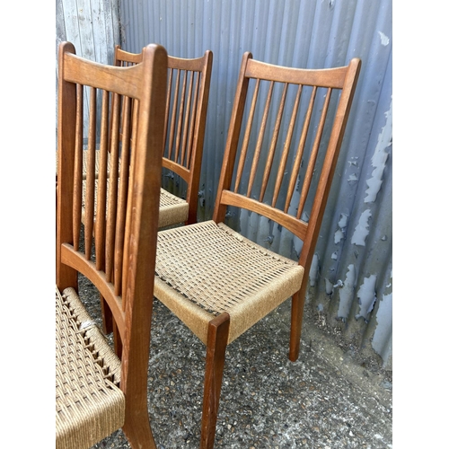 185 - A set of six danish teak dining chairs with rush seats by MOGENS KOLD