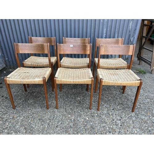 192 - A set of six danish style teak dining chairs with rush seats (some af)