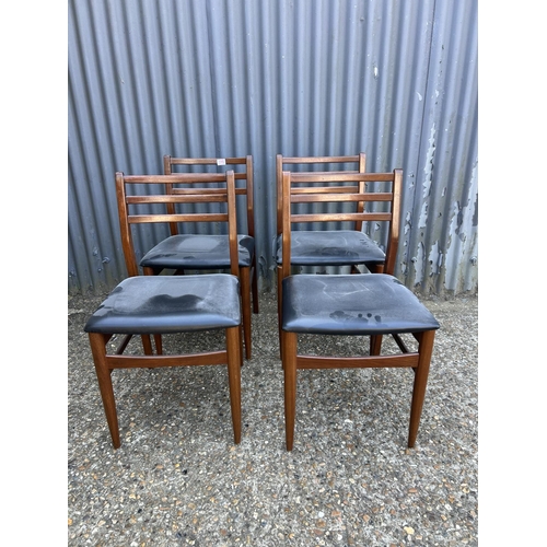 195 - A set of four teak dining chairs