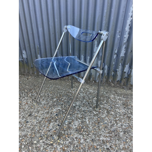 196 - A designer blue Perspex and steel folding chair