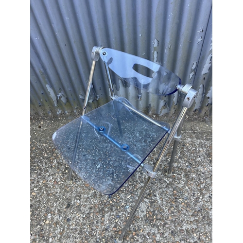 196 - A designer blue Perspex and steel folding chair