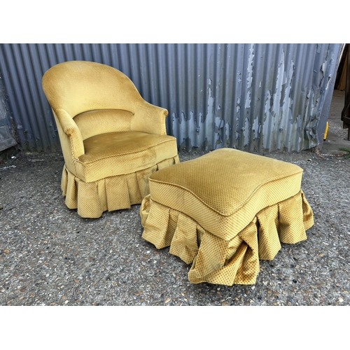 202 - A gold upholstered bedroom chair with matching footstool