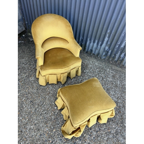 202 - A gold upholstered bedroom chair with matching footstool