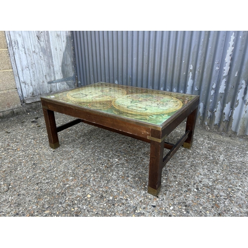 210 - A large reproduction coffee table with map top 104x73x47