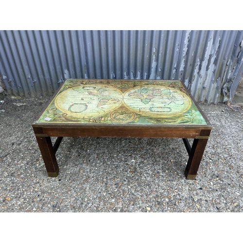 210 - A large reproduction coffee table with map top 104x73x47