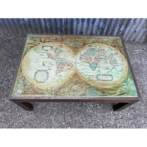 210 - A large reproduction coffee table with map top 104x73x47