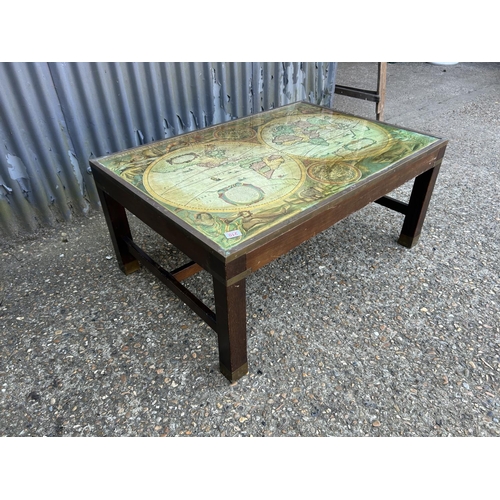 210 - A large reproduction coffee table with map top 104x73x47