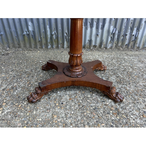 217 - A Victorian mahogany card table with fold over top and blue baize surface