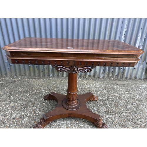 217 - A Victorian mahogany card table with fold over top and blue baize surface