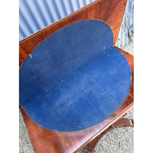 217 - A Victorian mahogany card table with fold over top and blue baize surface