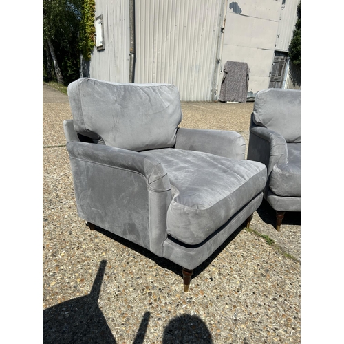 219 - A pair of good quality modern grey unholstered armchairs