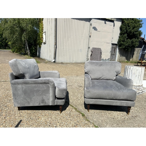 219 - A pair of good quality modern grey unholstered armchairs