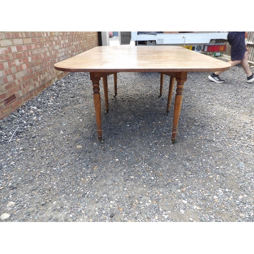 22 - A Victorian mahogany spider leg drop leaf dining table